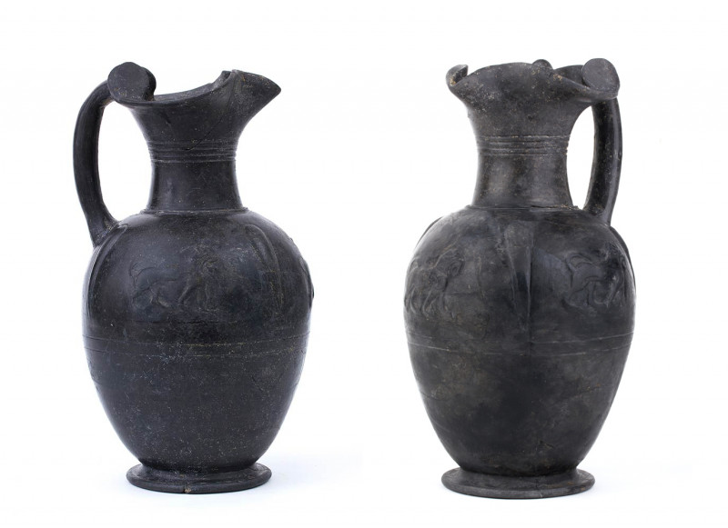 COUPLE OF ETRUSCAN BUCCHERO OINOCHOAI
ca. 550 BC
height cm 30 and 31

Molded in ...