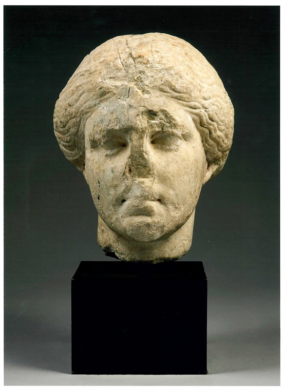 GREEK ATTIC MARBLE HEAD OF A WOMAN
Early 4th century BC
height (head) cm 31; hei...
