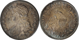 1812 Capped Bust Half Dollar. O-103. Rarity-1. MS-64+ (PCGS). CAC.

Mottled steel-blue and olive-russet highlights to a base of pewter-gray, the rev...
