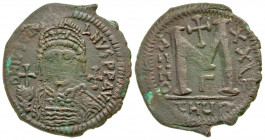 Justinian I. 527-565. AE follis (36 mm, 17.32 g, 6 h). Antioch / Theoupolis mint, Struck 552/3. D N IVSTIN[I]-ANVS P P AVI, helmeted and cuirassed fac...