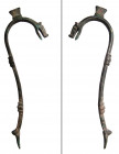 A Roman bronze handle for a vessel, ca. 1st - 3rd Century A.D. , the rim attachment in the form of a stylized feline head, a bladed element at top of ...