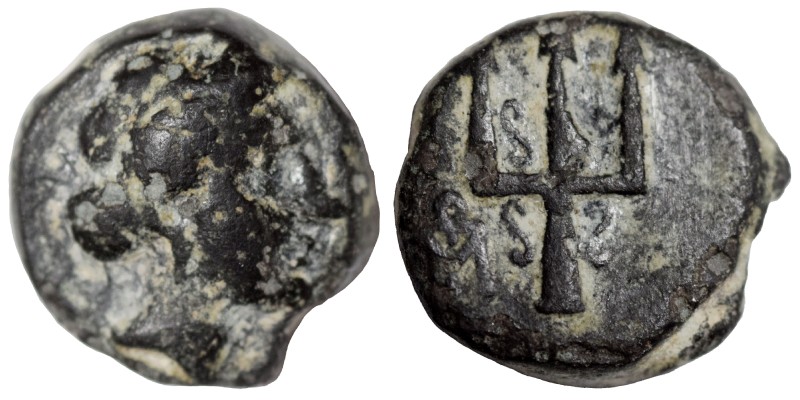 Greek. Ae (bronze, 2.41 g, 11 mm). Bust (Artemis?) right. Rev. Ornate trident he...