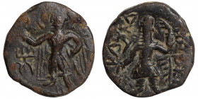 INDIA, Kushan Empire. Kanishka I, circa 127-152. Ae drachm (bronze, 3.81 g 18 mm). ÞAO ΚANηρKI Kanishka standing left, holding goad and standard, sacr...