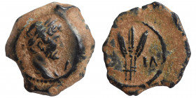 EGYPT. Alexandria. Hadrian, 117-138. Dichalkon (bronze, 1.14 g, 11 mm), dated RY 14 (129/30). Laureate head right; I to right. Rev. Bundle of three gr...