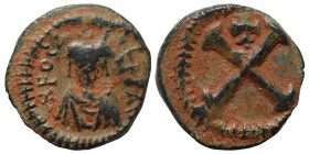 Phocas, 602-610. Decanummium (bronze, 1.91 g, 16 mm). Constantinople, struck 602/603? ONFOCAS PЄRPAVC Crowned, draped, and cuirassed facing bust. Rev....