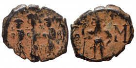 Constans II, with Constantine IV, Heraclius, and Tiberius, 641-668. Follis (bronze, 3.34 g, 25 mm), Constantinople, 659-663. Constans II standing faci...