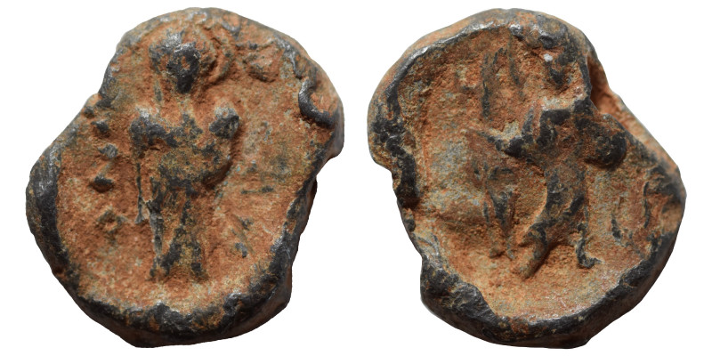 Lead seal (4.35 g, 17 mm). Nearly very fine. Illegible legend; standing figure f...