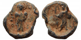 Lead seal (4.35 g, 17 mm). Nearly very fine. Illegible legend; standing figure facing. Rev. Standing Figure. Fine.
