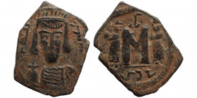 ISLAMIC, Umayyad Caliphate. temp. Mu'awiya I ibn Abi Sufyan, AH 41-60 / AD 661-680. Fals (bronze,2.48 g, 23 mm), Arab-Byzantine, derived from a Consta...