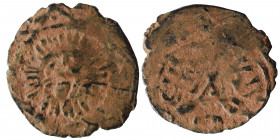 ISLAMIC. Īlkhānids. Fals (bronze, 0.90 g, 17 mm). Sun-Face within star. Rev. Arabic legend. Fine.
