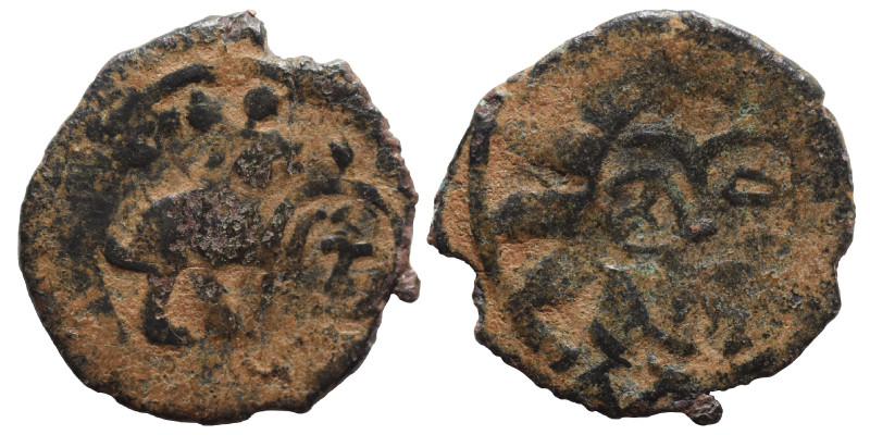 ISLAMIC. Īlkhānids. Fals (bronze, 1.08 g, 16 mm). Sun-Face Rev. Lion (?) to righ...