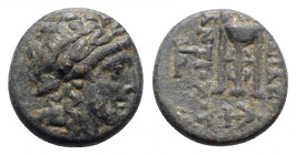 Seleukid Kings, Antiochos II (261-246 BC). Æ (16.5mm, 4.67g, 12h). Tralles(?). Laureate head of Apollo r. R/ Tripod; monograms to outer l. and r., anc...