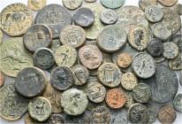 A lot containing 67 bronze coins. Includes: Greek and Roman Provincial coins. Fine to very fine. LOT SOLD AS IS, NO RETURNS. 67 coins in lot.