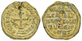 BYZANTINE LEAD SEAL.(Circa 11th Century).PB Seal.

Obv : A patriarchal cross mounted on a base of three steps. Fleurons on either side.Border of dot...