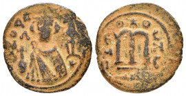 ARAB-BYZANTINE.Hims (685-690).Fals.

Obv : KAΛON.
Crowned imperial bust facing, holding globus cruciger.

Rev : Large cursive M above exergual line.
S...