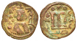 ARAB-BYZANTINE. Early Caliphate.(660-690).Fals.

Obv : Crowned imperial bust facing, holding globus cruciger.

Rev : Large cursive M above exergual li...