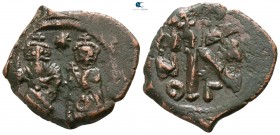 Heraclius, with Heraclius Constantine and Heraclonas AD 610-641. Constantinople. Half follis Æ