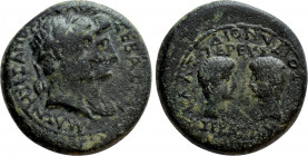 LYDIA. Magnesia ad Sipylum. Augustus with Livia, Gaius and Lucius (27 BC-14 AD). Ae. Dionysios Kilas, son of Dionysios, priest of Augustus