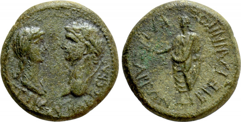 LYDIA. Tralles (as Caesarea). Claudius with Messalina (41-54). Ae. 

Obv: TI K...