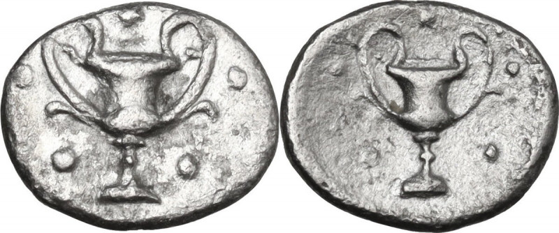 Greek Italy. Southern Apulia, Tarentum. AR Obol, 280-228 BC. Obv. Kantharos surr...