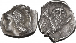 Greek Italy. Southern Apulia, Tarentum. AR Drachm, c. 281-272 BC. Obv. Head of Athena left, wearing Attic helmet decorated with Scylla, with hair flow...