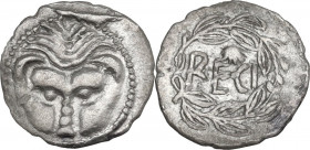 Greek Italy. Bruttium, Rhegion. AR Litra, c. 435-425 BC. Obv. Lion's mask. Rev. RECI; above, scallop-shell, all within olive wreath. HN Italy 2490 var...