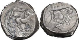 Sicily. Gela. AR Tetradrachm, c. 440-430 BC. Obv. Charioteer driving slow quadriga right; above, Nike flying right, crowning horses with wreath; branc...
