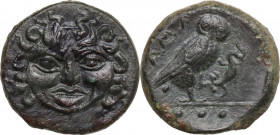 Sicily. Kamarina. AE Tetras, c. 420-410 BC. Obv. Gorgoneion with wild locks. Rev. [K]AMA. Owl standing right, grasping lizard; three pellets in exergu...
