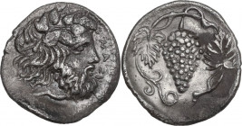Sicily. Naxos. AR Litra, c. 415-403 BC. Obv. ΝΑΞΙ. Bearded head of Dionysos right, wearing ivy wreath. Rev. Grape cluster surrounded by vine tendril a...