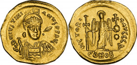 Justinian I (527-565). AV Solidus, Constantinople mint, 527-538 AD. Obv. DN IVSTINIANVS PP AVI. Helmeted and cuirassed bust facing slightly right, hol...