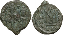 Heraclius (610-641) with Heraclius Constantine. AE Follis, Ravenna mint, 630/1 AD. Obv. [ ]NNHЄ[ ] Heraclius with long beard on left wearing military ...