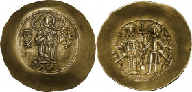 Manuel I Comnenus (1143-1180). EL Aspron Trachy, Constantinople mint, c. 1160-1164 AD. Obv. Christ Pantokrator standing facing; bearded and wearing ni...