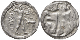 Bruttium, Caulonia, Incuse Stater, ca. 500-480 BC; AR (g 8,21; mm 27; h 12); Apollo advancing r., holding branch; small daimon running on his arm; on ...