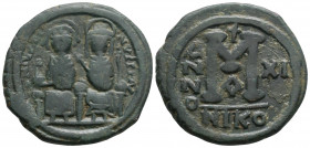 Byzantine
Justin II, with Sophia, (565-578 AD) Nicomedia 
AE Follis (30mm, 12.2g)
Obv: D N IVSTINVS P P AVG Justin II, holding globus cruciger in his ...