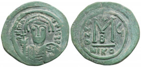 Byzantine
Maurice Tiberius (582-602 AD) Nikomedia
AE Follis (34.1mm, 12g)
Obv: Helmeted and cuirassed bust facing, holding globus cruciger and shield ...