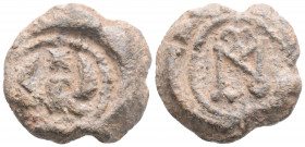 Byzantine Lead Seal (7th-8th centuries)
Obv: Eagle standing facing, head and tail right, wings spread; star above
Rev: Cruciform monogram
(11.6 g, 23....