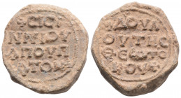 Byzantine Lead Seal ( 7th century)
Obv: 4 (four) lines of text.
Rev: 4 (four) lines of text.
(15.9 g, 25.9 mm diameter)