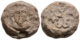 Byzantine Lead Seal (6th-7th century)
Obv: Nimbate facing bust of the saint. 
Rev: Cruciform monogram of Iωάννου
(15.7g 22.7g)