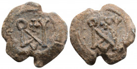 Byzantine lead seal. (6th-7th centuries) 
Justın I
Obv: Block monogram.
Rev: Block monogram.
(9.1g, 22.9mm diameter)