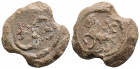 Byzantine lead seal. (6th century) 
Sergios chartularios 
Obv: Mule walking l.; above, monogram: ΧΑ Wreath border.
Rev: Monogram of Sergios: Σεργίου. ...