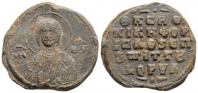 Byzantine lead seal. (9th-11th centuries).
Obv: Bust of Christ holding book of Gospels
Rev : 5 (Five) lines text
(8.5 g 25.1 mm diameter)