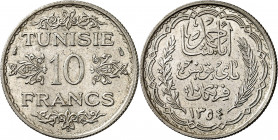 Ahmed, Bey (1929-1942). 10 francs AH 1354, Paris.
NGC MS 62 (5788036-010).
Av. TUNISIE 10 FRANCS et (différents), entre quatre fleurons. 
Rv. Dans ...