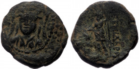 Ionia, Lebedos, AE (Bronze, 19,8 mm, 5,96 g), ca. 133-80 BC.
Obv: Helmeted head of Athena facing slightly left. 
Rev: [APT ?]EMIΔEPo[…], Dionysos stan...