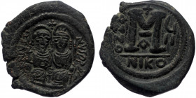 Justin II. 565-578. Æ Follis (Bronze, 30mm, 14.38g) Nicomedia, Dated RY 7 (572/573). 
Obv: Justin and Sophia, both nimbate, enthroned facing; Justin h...