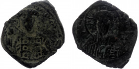Michael VII Ducas (1071-1078) Æ follis (Bronze, 6,26g, 29mm) Constantinople mint.
Obv: IC-XC - nimbate bust of Christ facing, nimbate cross behind hea...