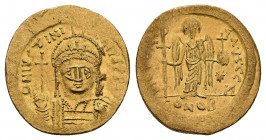 JUSTINIAN I (527-565 AD). AV, Solidus. Constantinople.
Obv: D N IVSTINIANVS P P AVG. 
Helmeted and cuirassed bust facing, holding globus cruciger an...
