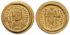 JUSTINIAN I (527-565 AD). AV, Solidus. Constantinople.
Obv: D N IVSTINIANVS P P AVG. 
Helmeted and cuirassed bust facing, holding globus cruciger an...