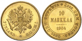 1904. Finlandia. Nicolás II. L. 10 markaa. (Fr. 6) (Kr. 8.2). 3,22 g. AU. Bellísima. Rara y más así. S/C-.