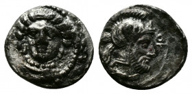 (Silver 0.65g 10mm) Cilicia. Tarsos. Time of Pharnabazos or Datames 379-372 BC. Obol AR
Female head (Arethusa?) facing slightly left
Rev: Helmeted and...