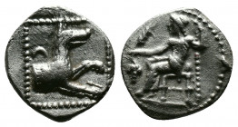 (Silver 0.66g 11mm) LYCAONIA. Laranda. Obol (Circa 324/3 BC).
Baal seated left on throne, holding grain ear, grape bunch and sceptre.
Rev: Forepart of...